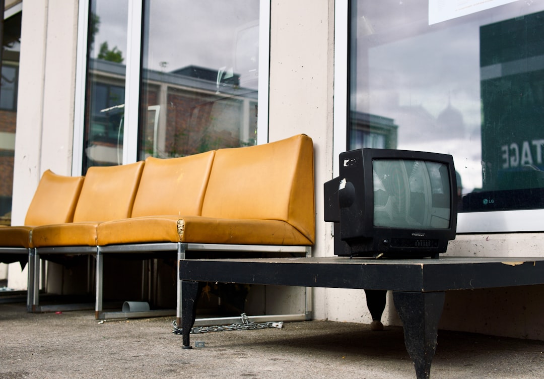 a table with chairs and a speaker
